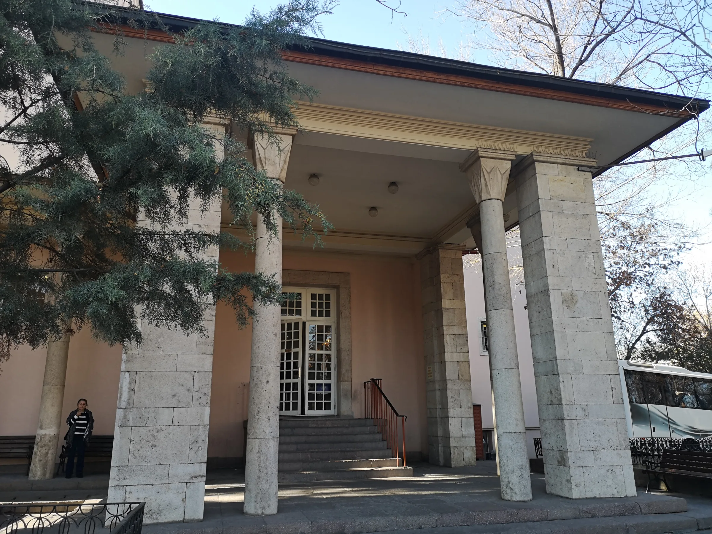 Columned entrance, steps and doors at Ankara Opera Binası in daylight