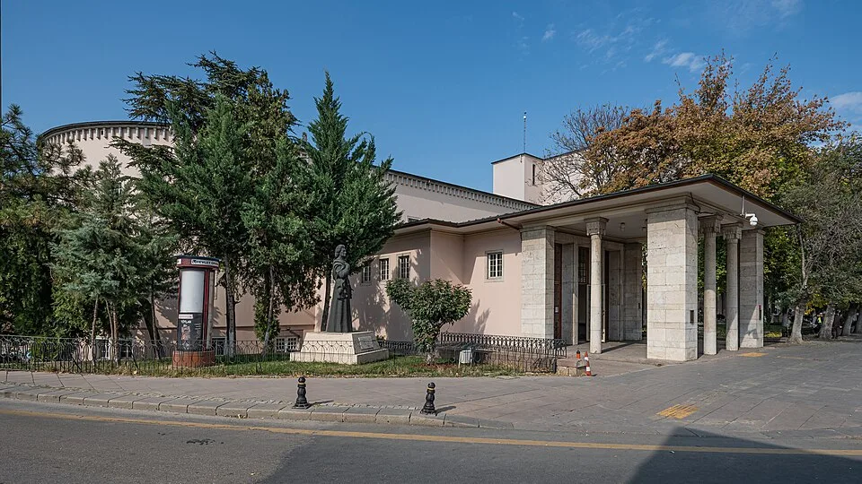 Ankara Opera House and Büyük Tiyatro exterior, with trees and a stone-columned entrance