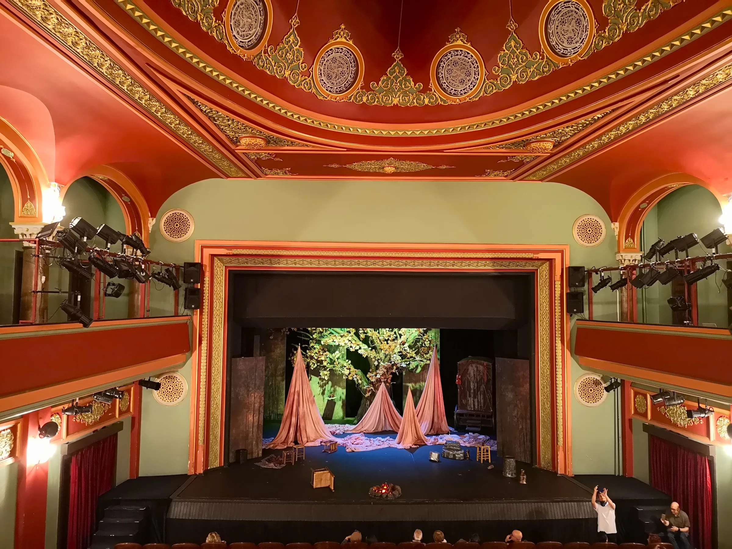 Küçük Tiyatro auditorium with decorated ceiling, balconies and the stage