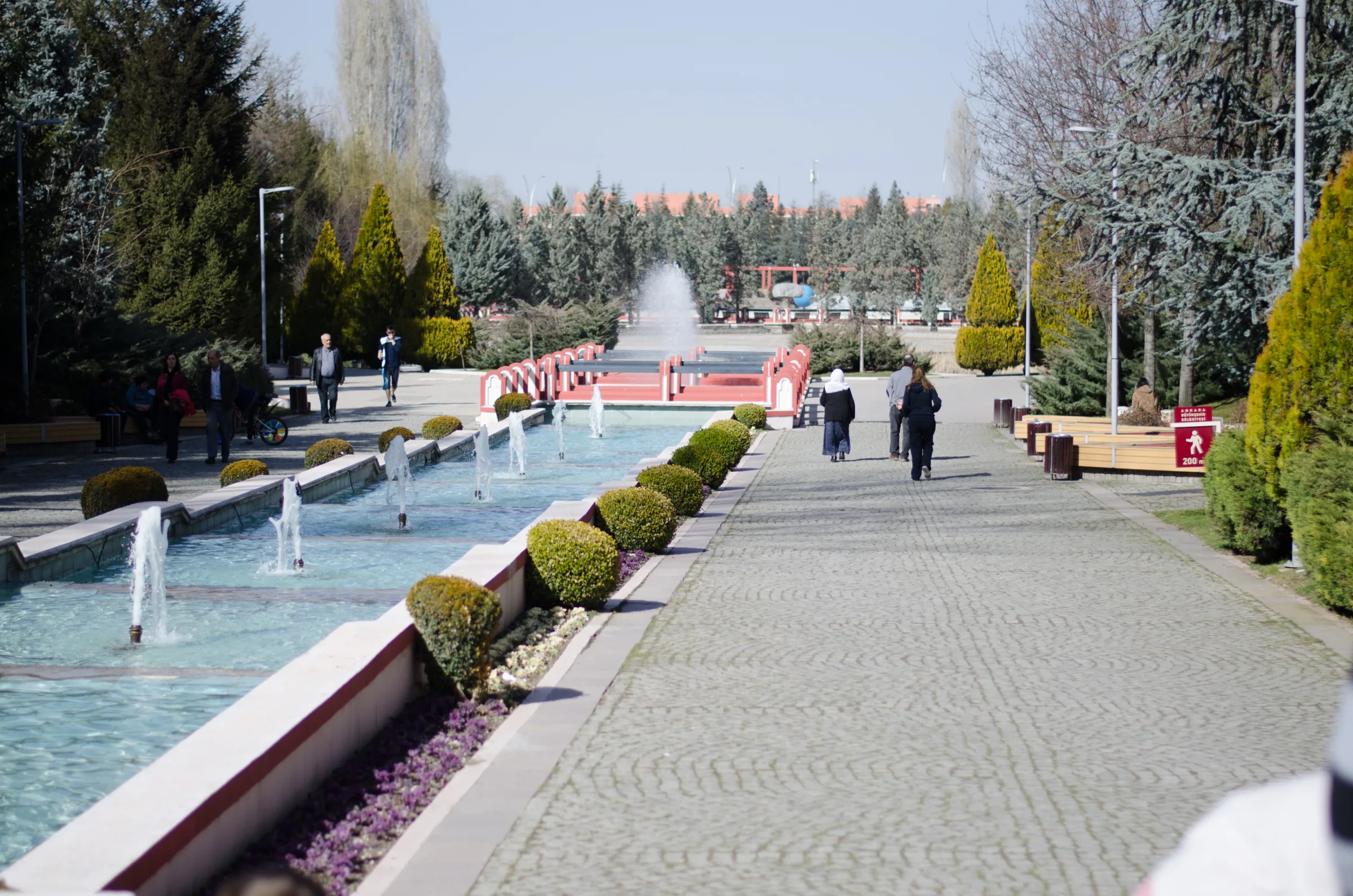 Walkways, trimmed trees and a long fountain pool in Dikmen Vadisi